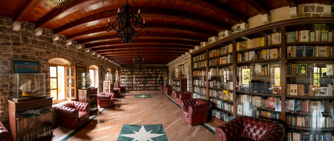Grand library hall with arched ceiling and bookshelves