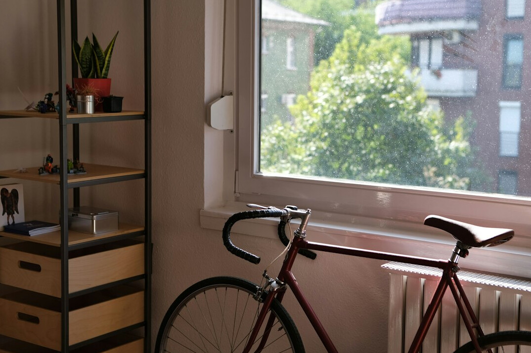 Bright quiet office space with large windows and a desk