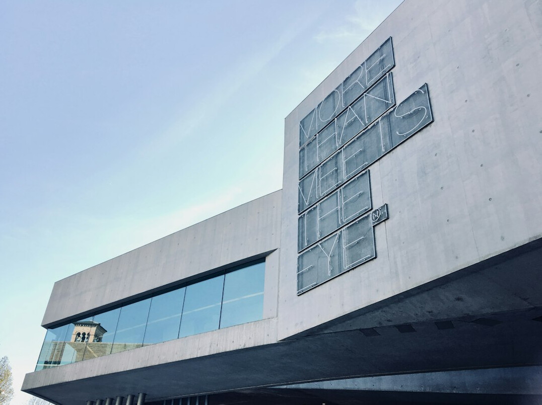 Modern glass and concrete broadcast building facade